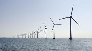 Line of wind turbines across the sea 